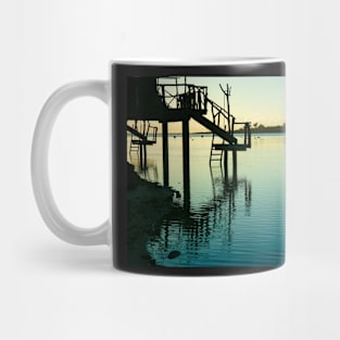 Steps from cabin leading into idyllic tropical lagoon. Mug